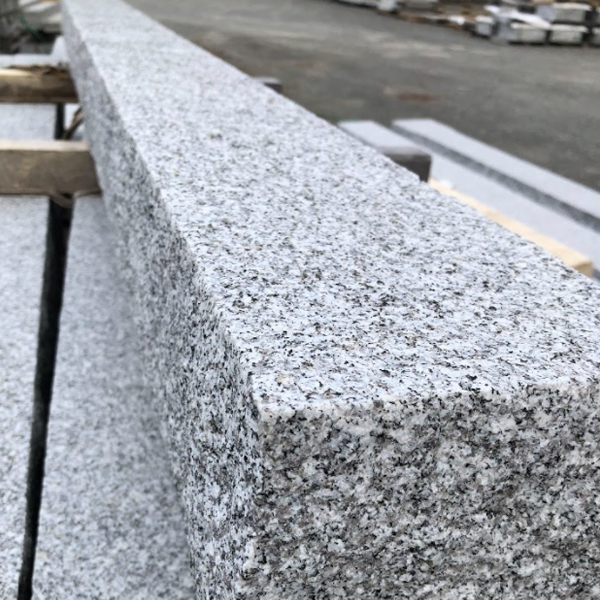 Close Up of Concrete Mailbox Post black, white and grey color pattern